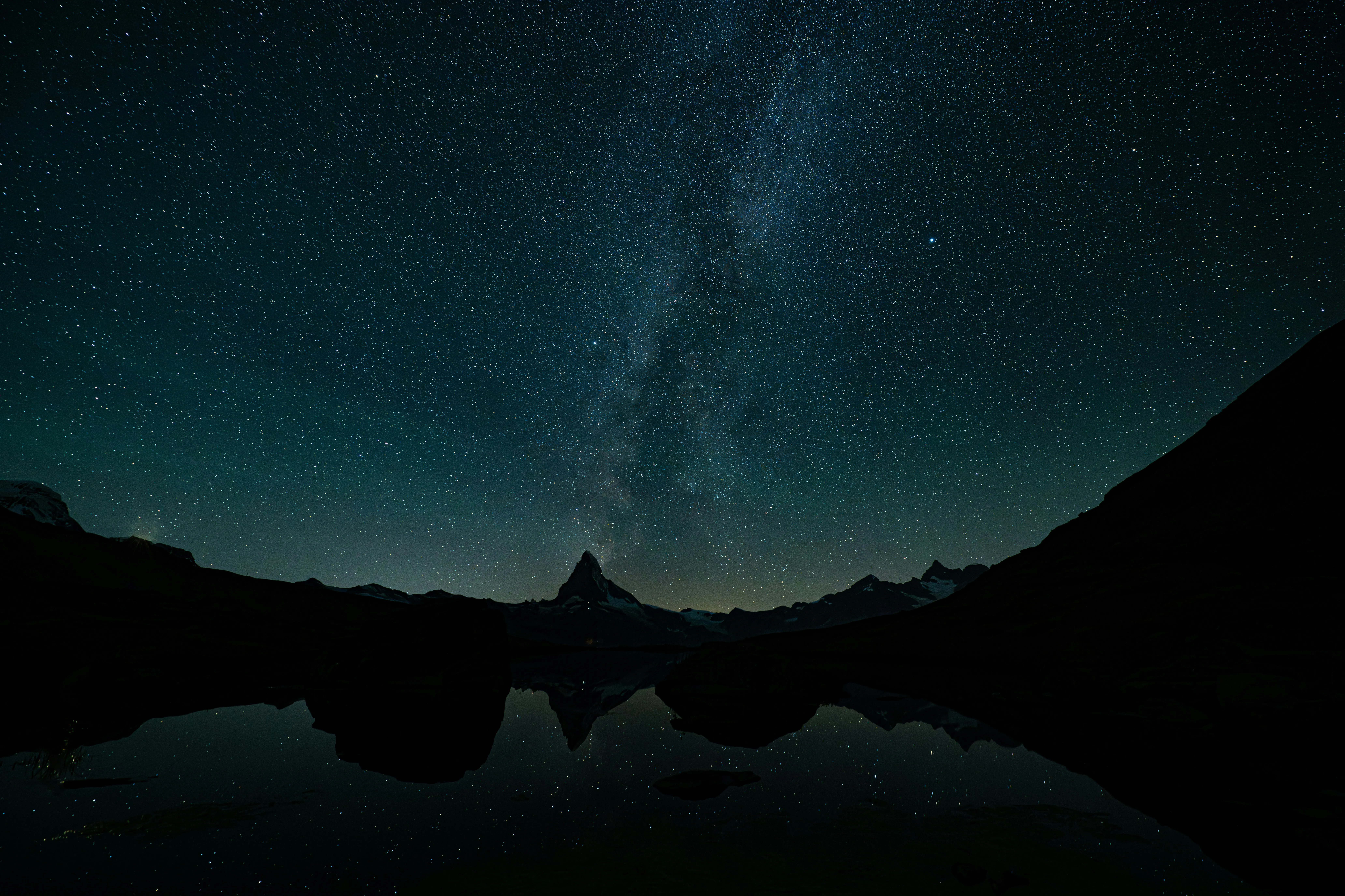 Breathtaking Starry Night: Milky Way Mirrored in Alpine Lake.