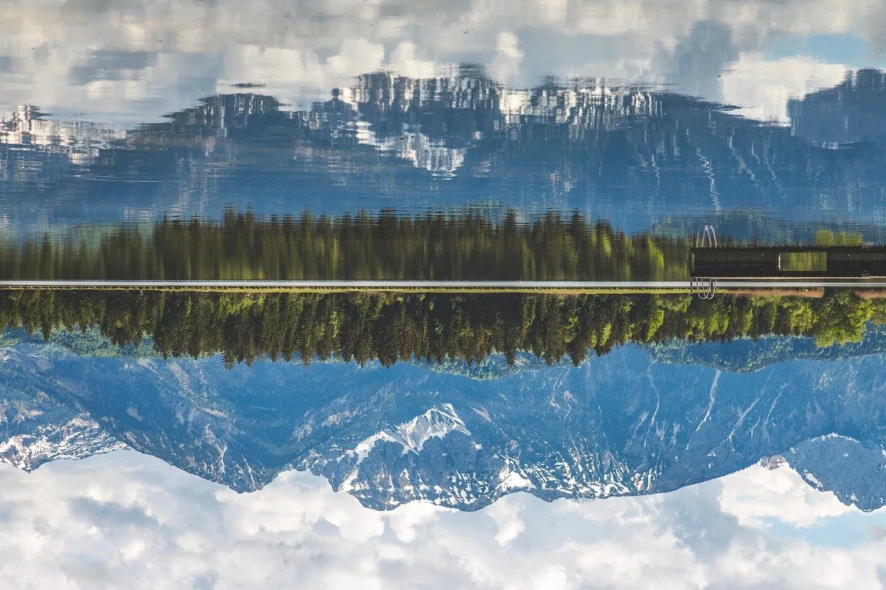Stunning Alpine Lake Mirroring Sky and Peaks