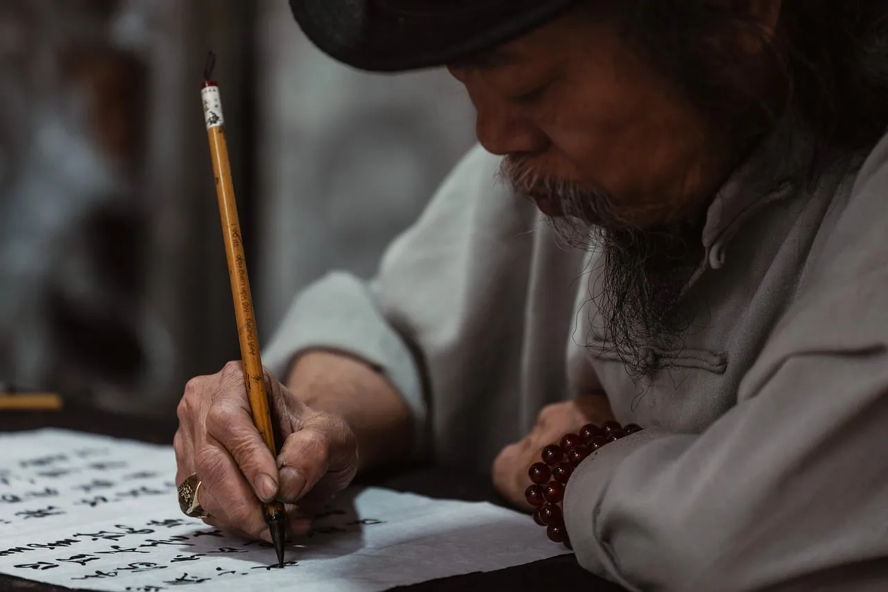 Timeless Asian Art: Elderly Man's Calligraphy Mastery
