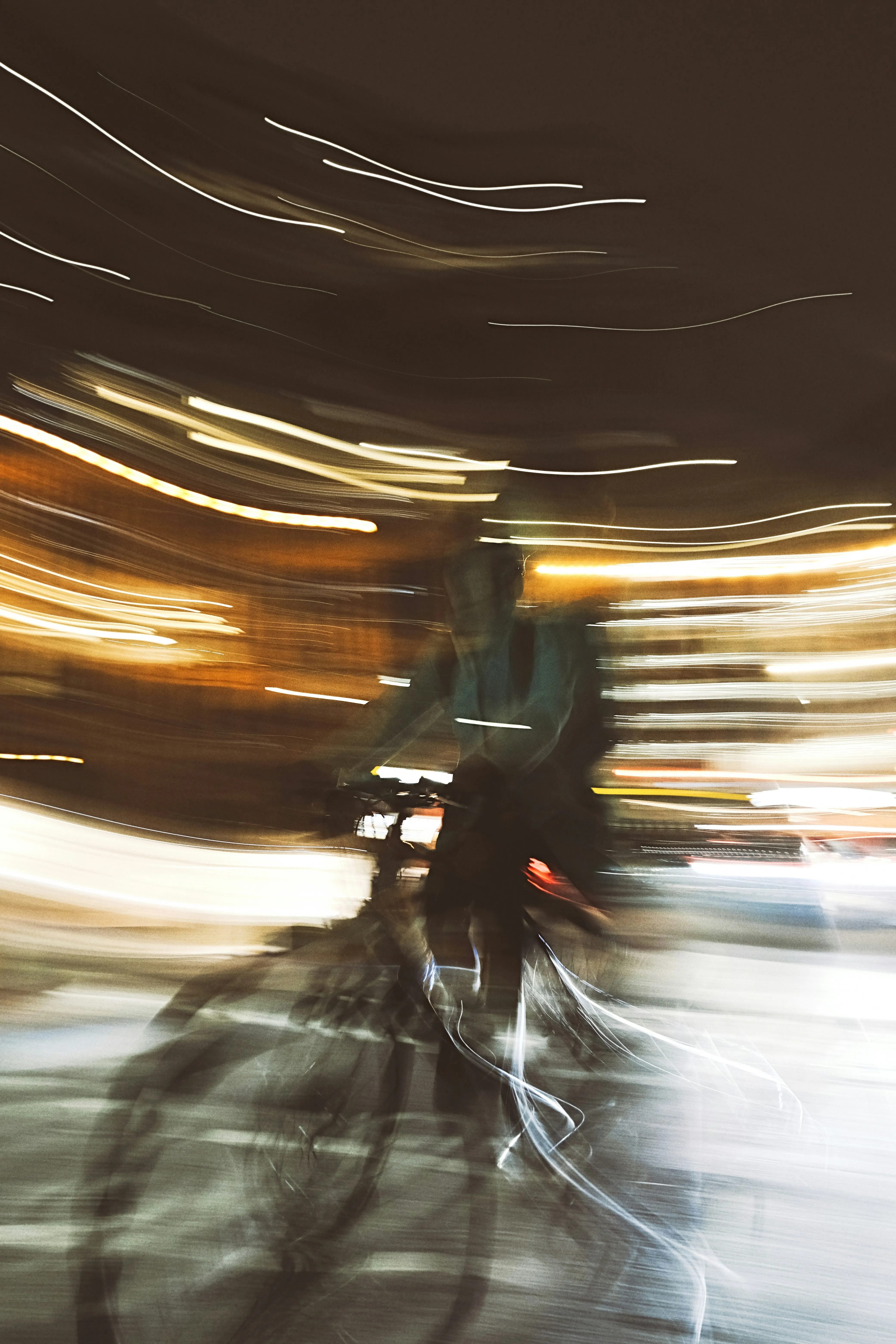 Vibrant Night Blur: Cyclist's Dynamic Journey Through City Lights