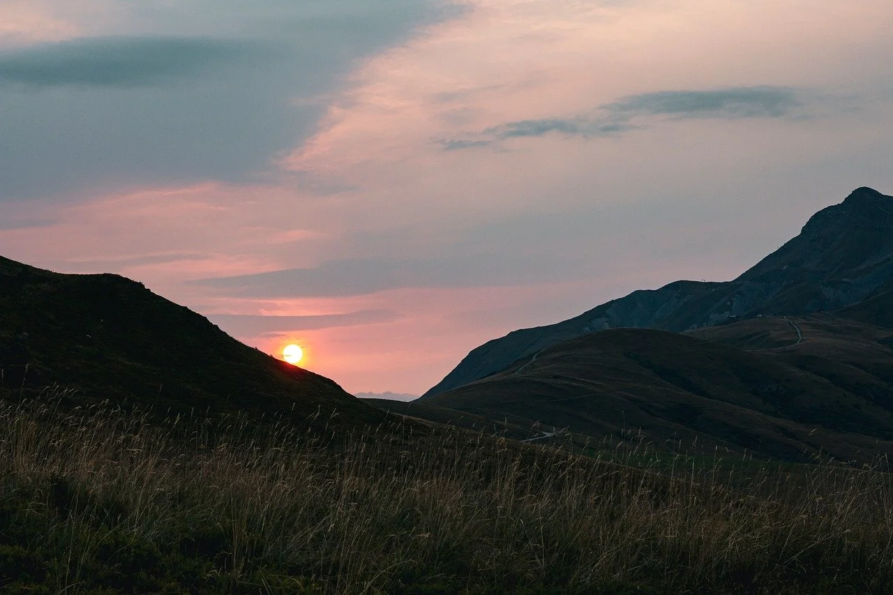 Breathtaking Autumn Sunset Over Serene Mountain Meadows