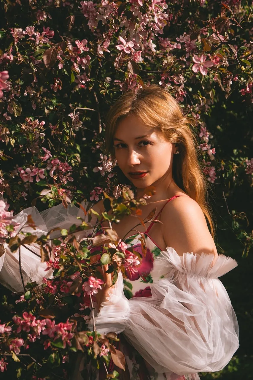 Enchanting Spring Portrait: Woman Amidst Blossoming Sakura