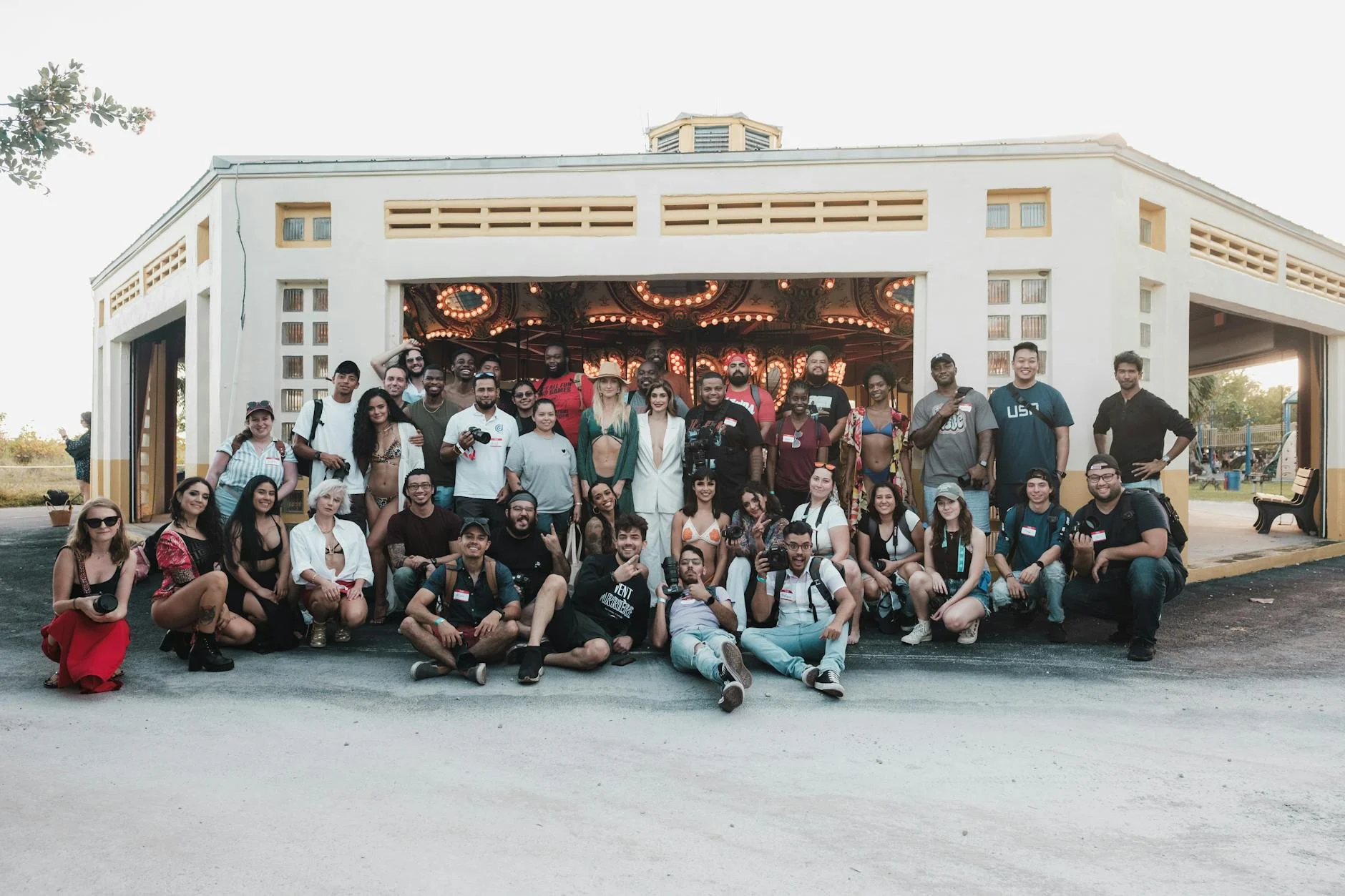 Vibrant Group Captures Joyful Moments by the Carousel