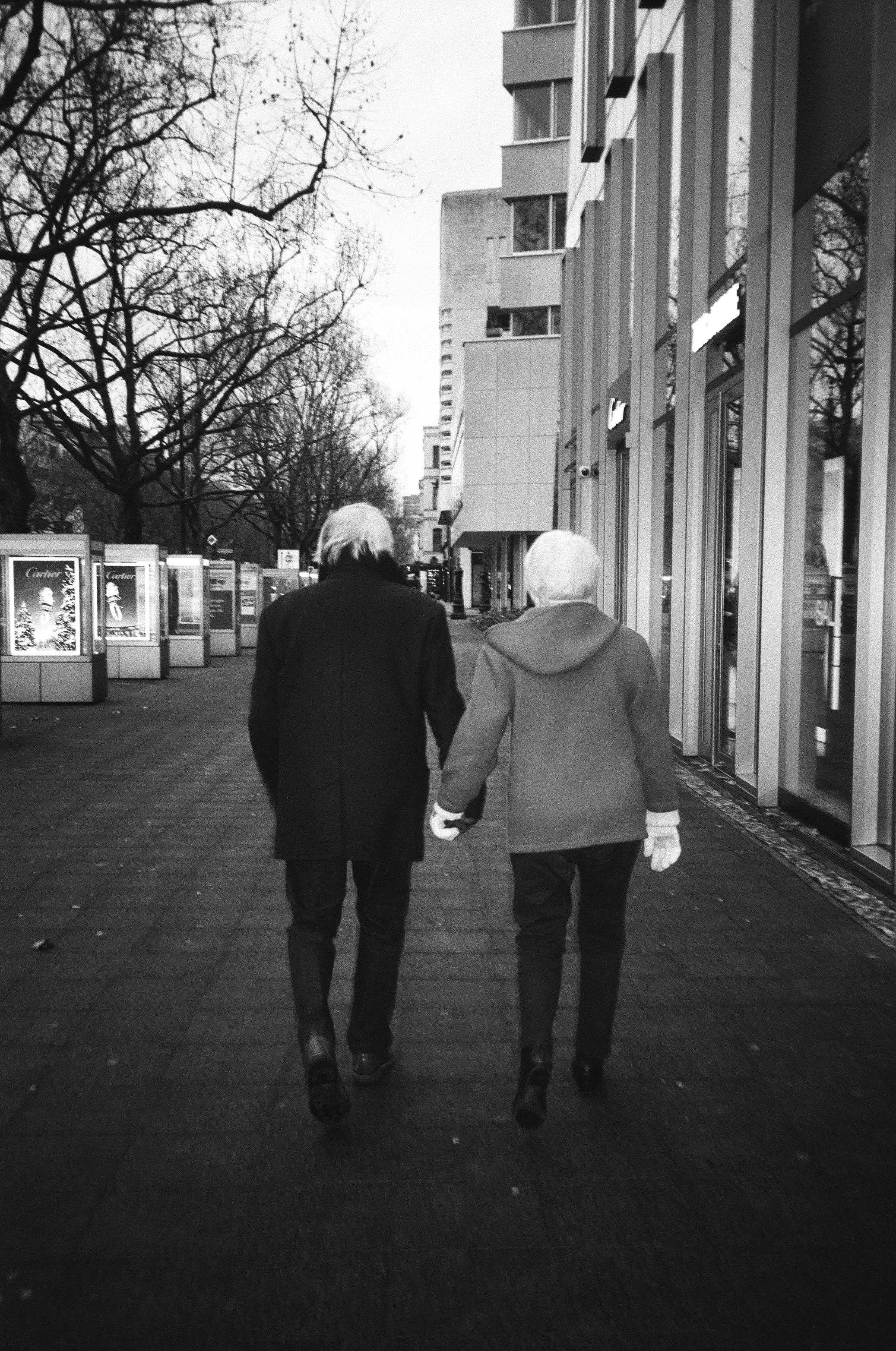 Timeless Love: Elderly Couple's Hand-in-Hand Stroll