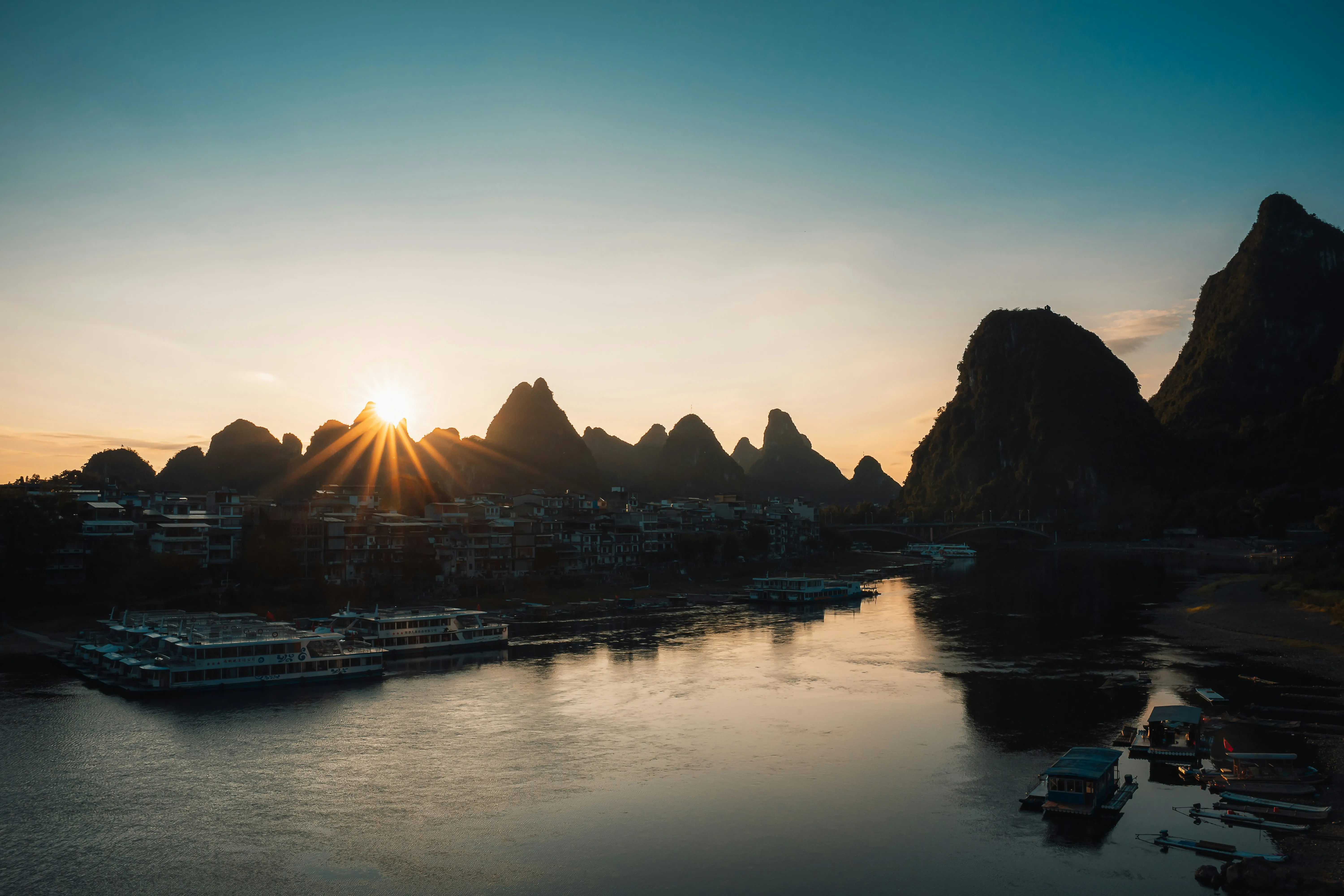 Breathtaking Karst Sunrise over Serene River Landscape