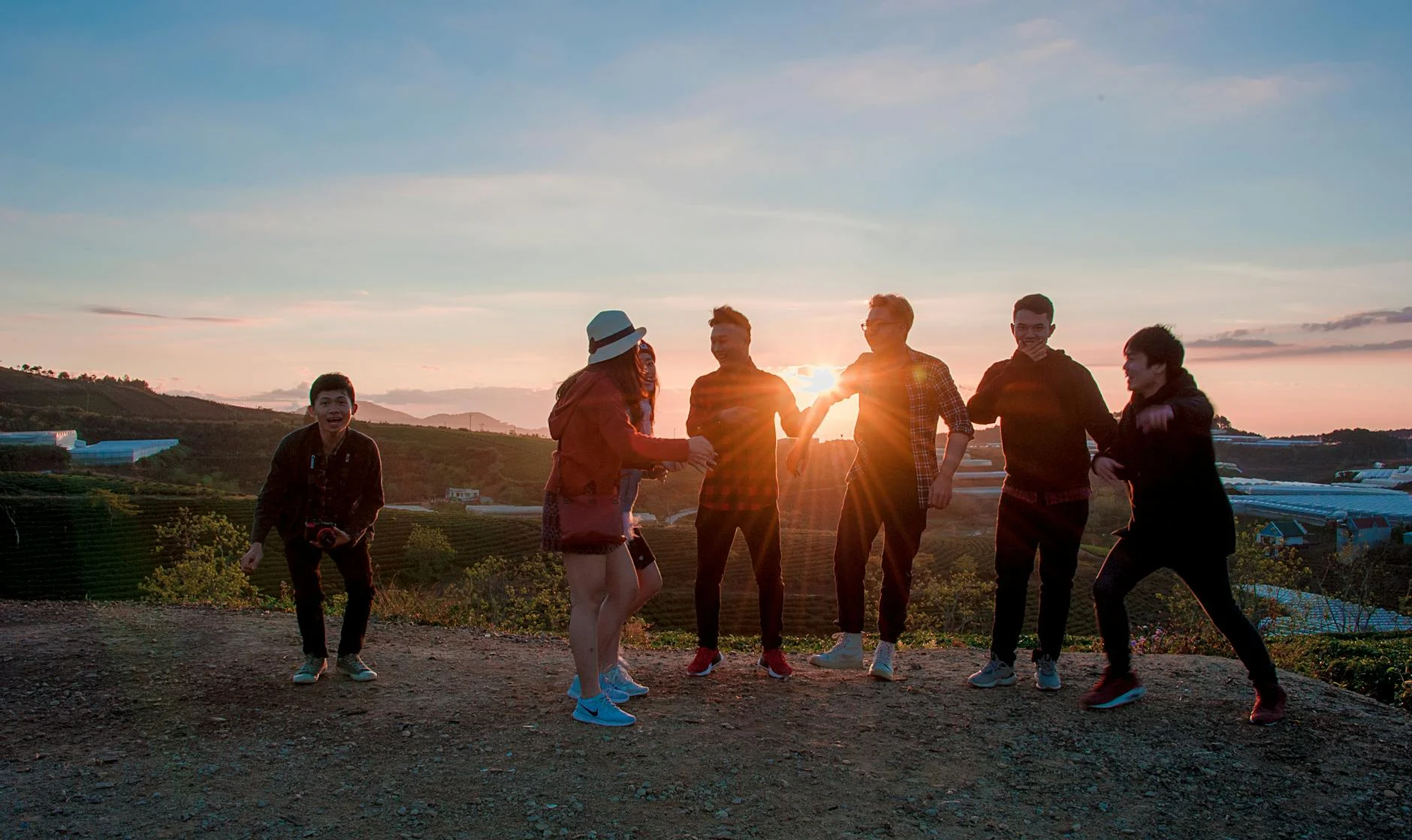 Vibrant Sunset Gathering: Friends Embrace Golden Hour