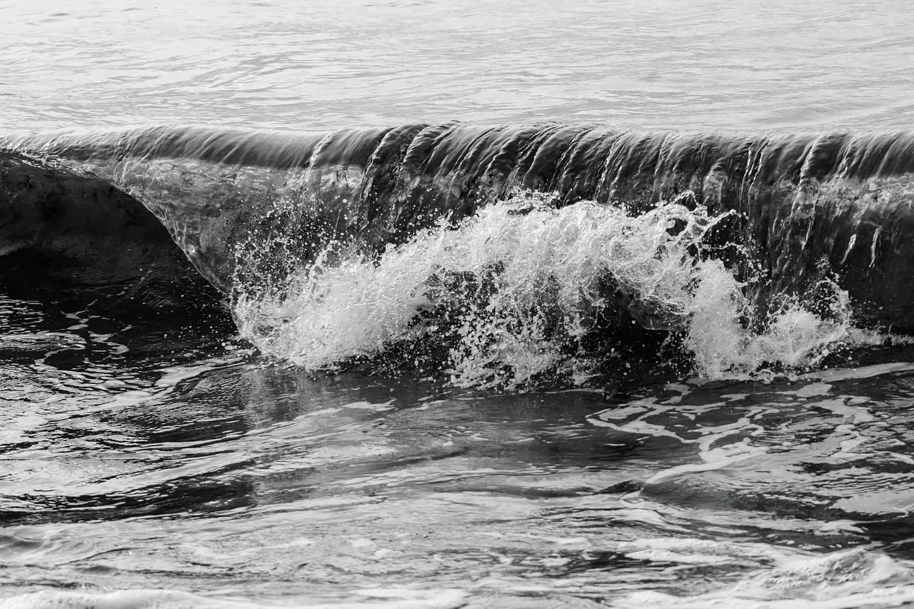 Dramatic Monochrome Ocean Wave Crashes on Baltic Coast