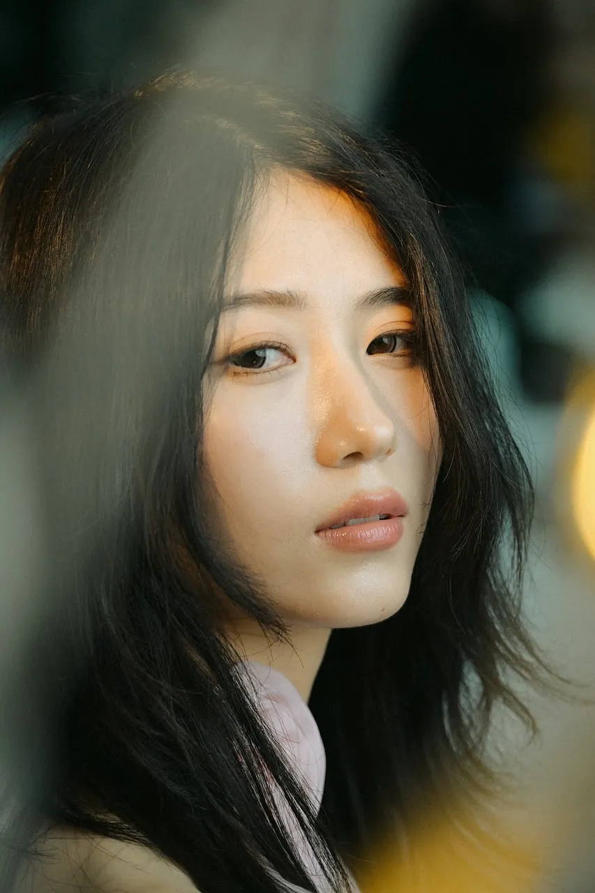 Captivating Gaze: Intimate Portrait of a Reflective Woman