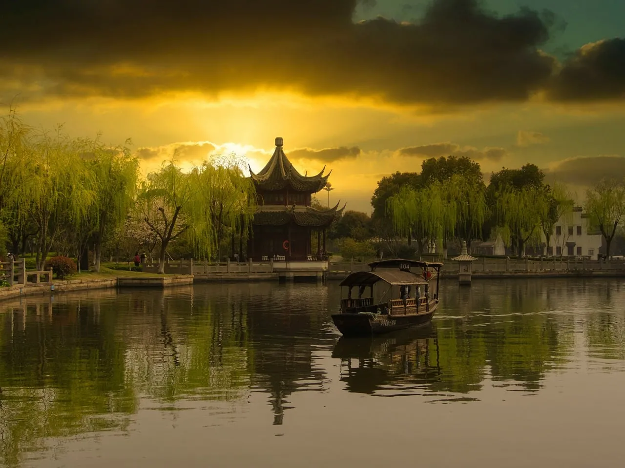 Breathtaking Sunset over Ancient Chinese Pavilion and Serene Lake