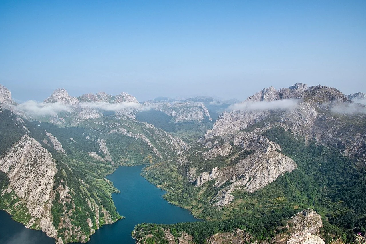 Breathtaking Panoramic Vista of Ruesga's Serene Mountain Lake