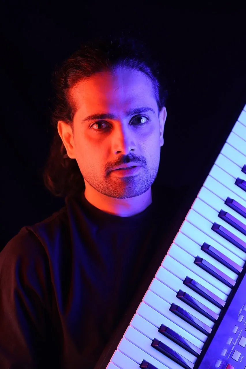 Vibrant Keyboardist Portrait: Dramatic Lighting and Musical Passion