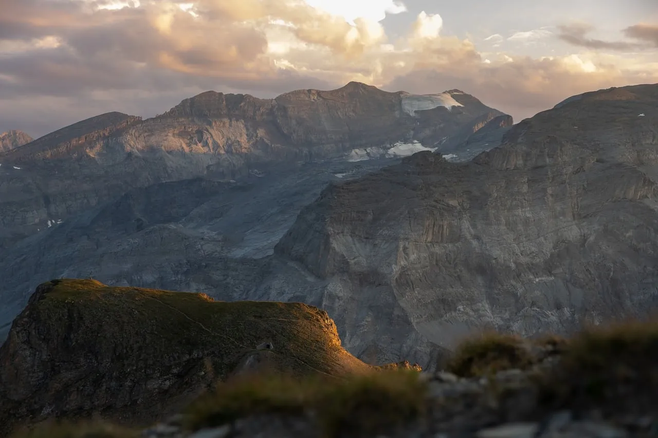 Dramatic Alps Sunrise: Golden Light on Rugged Peaks