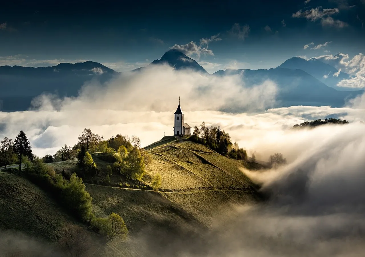Mystical Slovenian Church Emerges from Ethereal Morning Fog