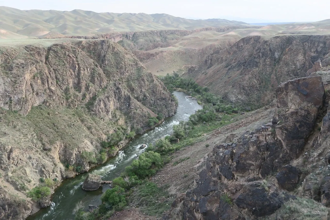 Breathtaking Kazakhstan Canyon: River Serenity Amidst Rugged Peaks