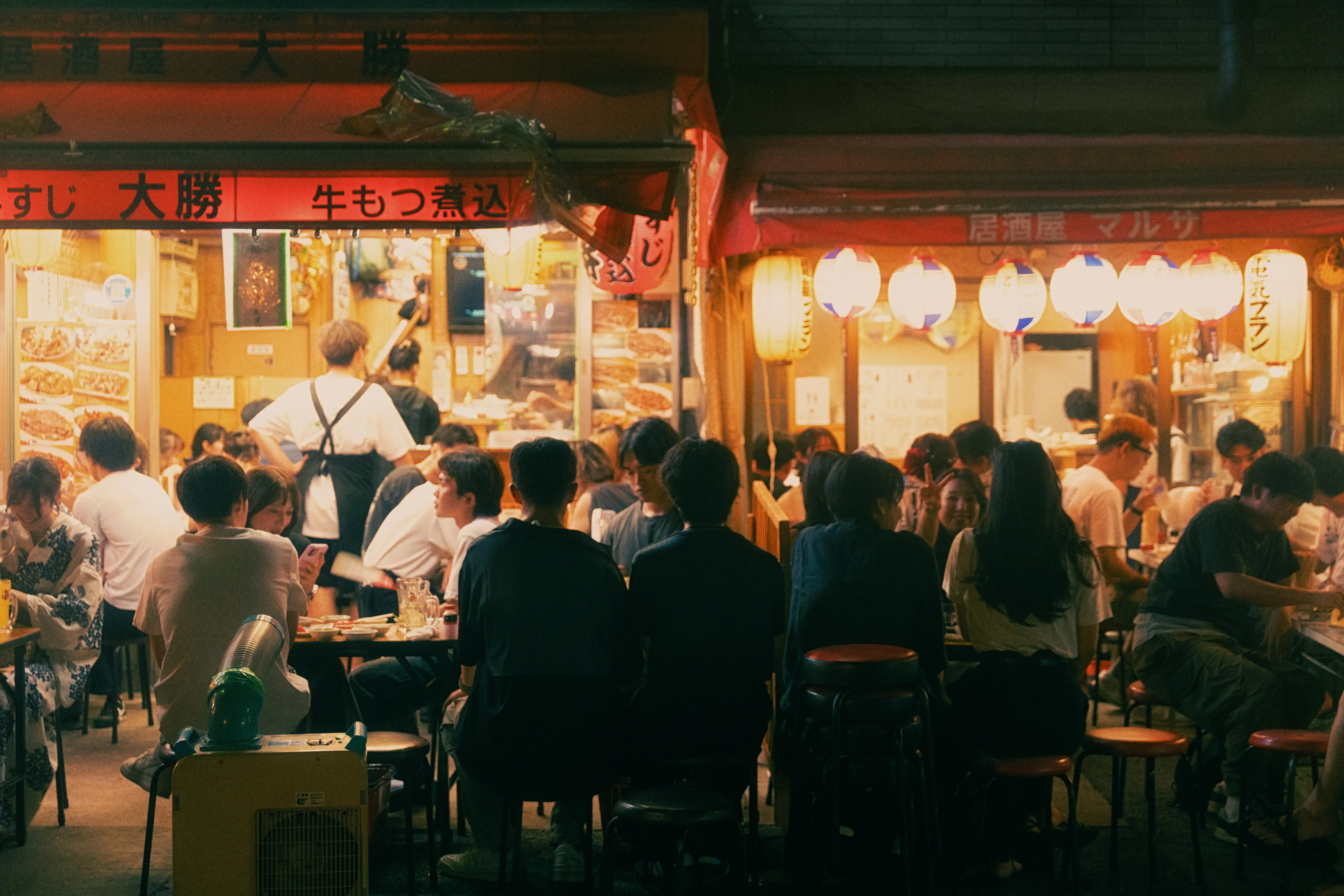 Vibrant Tokyo Nights: Bustling Japanese Restaurant Life