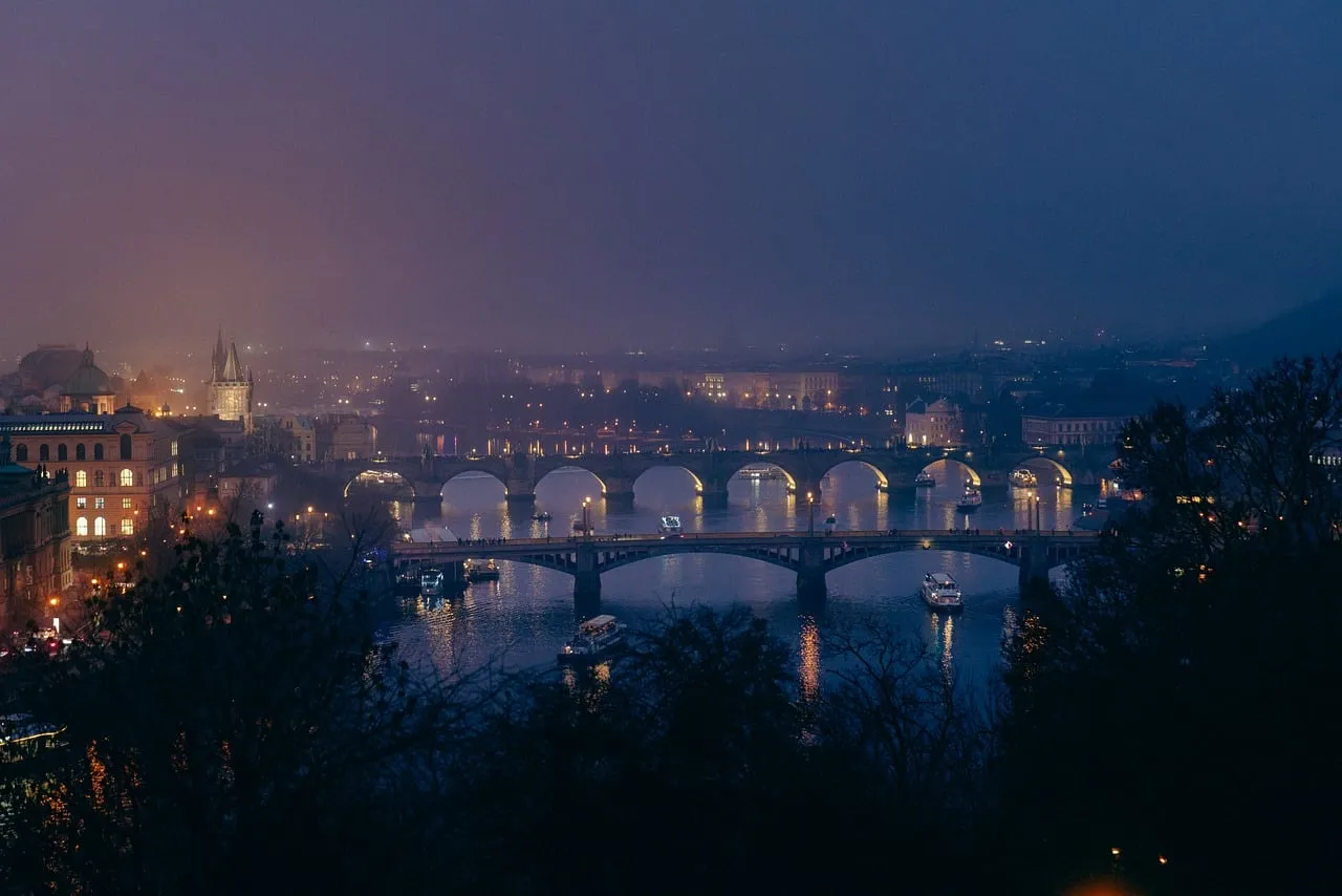 Prague's Enchanting Night: Bridges Aglow Over Vltava