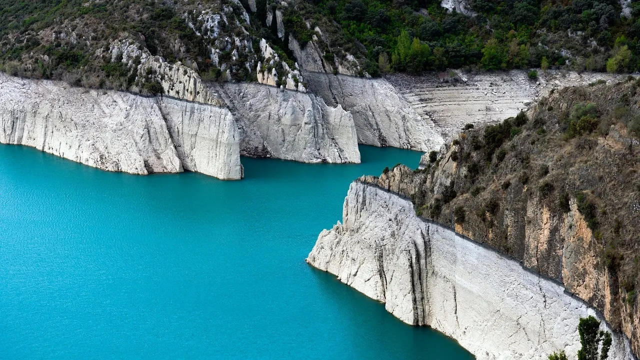 Stunning Azure Lake Nestled Amidst Dramatic Limestone Cliffs