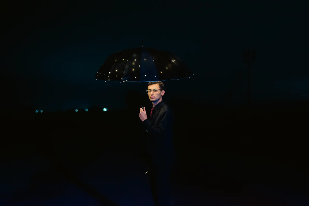 Enigmatic Night: Dapper Man with a Starry Umbrella in 4K