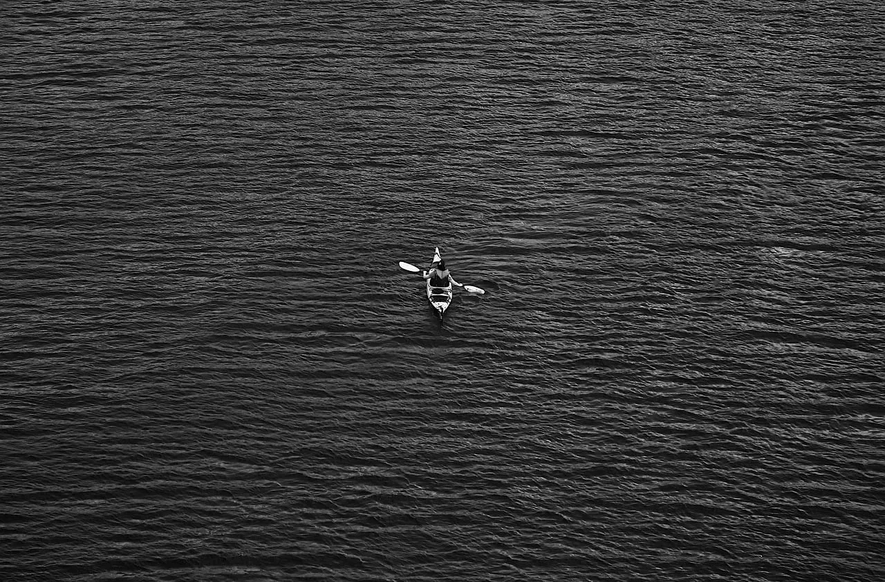 Solitude on the Sea: Serene Black and White Paddling Adventure
