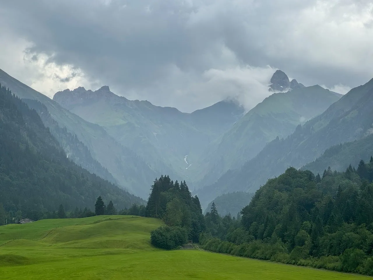 Dramatic Mountain Majesty: Misty Peaks and Verdant Valleys