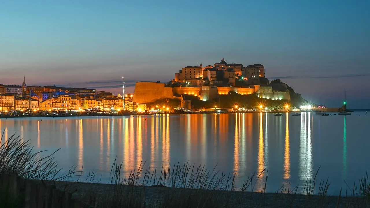 Enchanting Calvi Citadel: Illuminated Harbor at Twilight