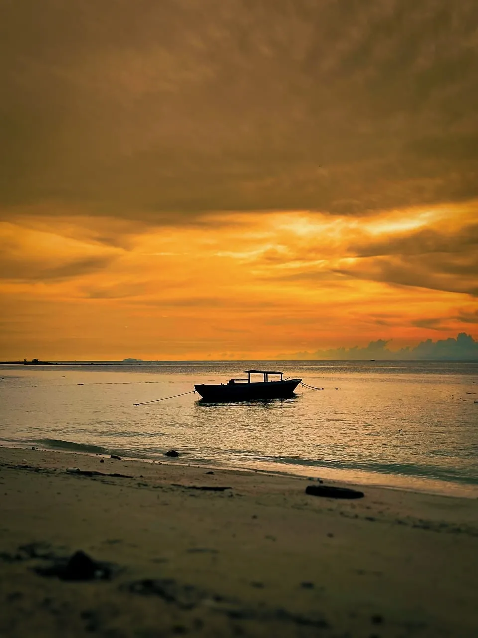 Breathtaking Sunset Serenity: A Lone Boat on the Horizon