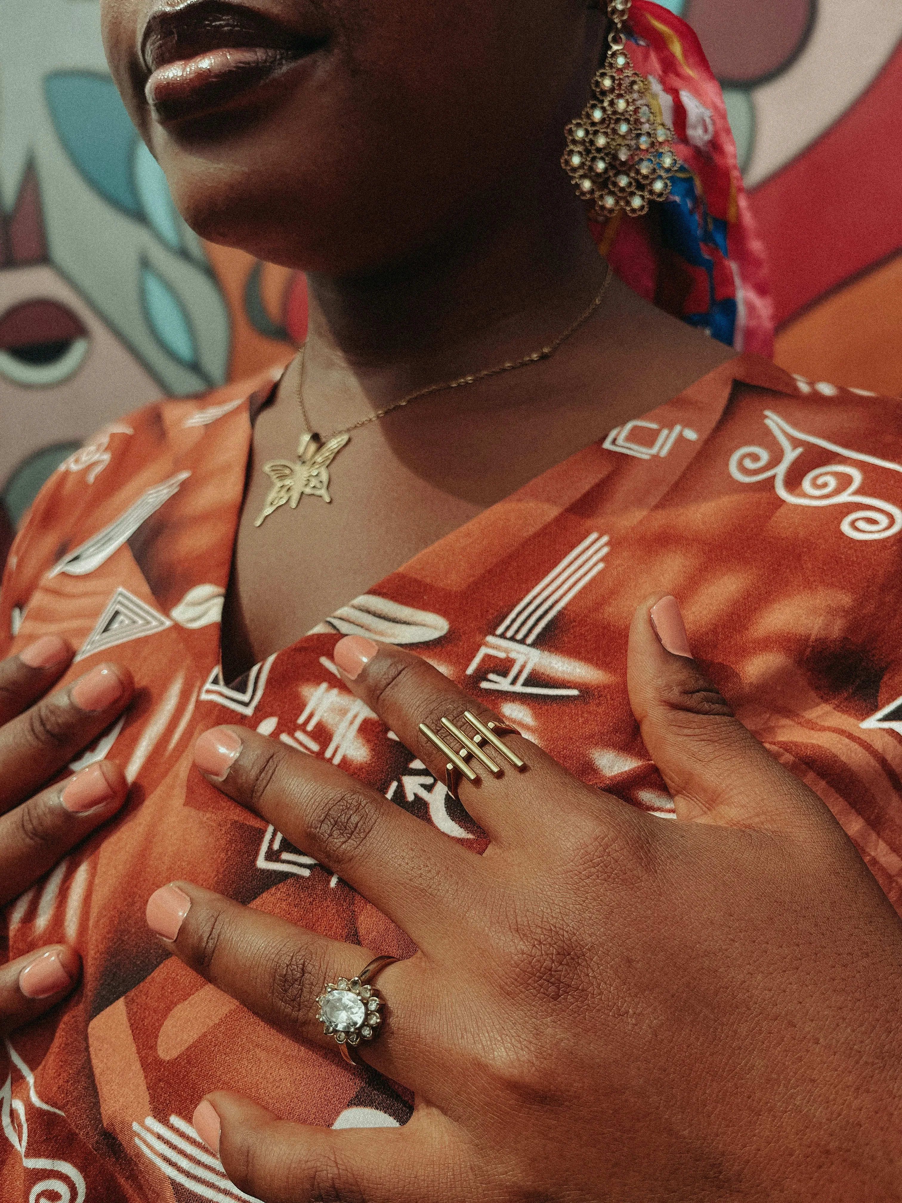 Exquisite Style: Woman Adorned in Vibrant Patterns and Golden Jewelry
