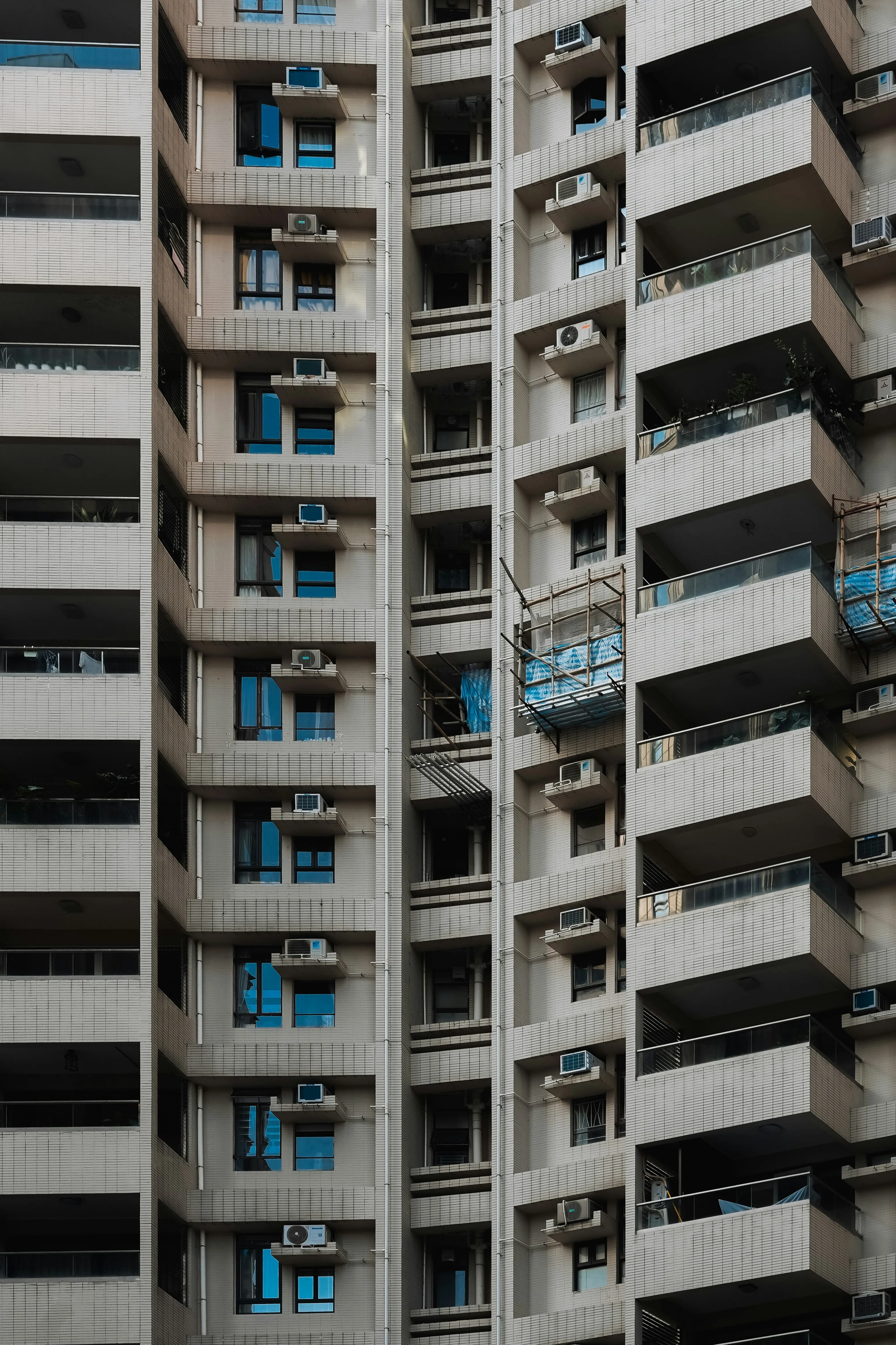 Towering Urban Density: Modern Apartment Building Facade