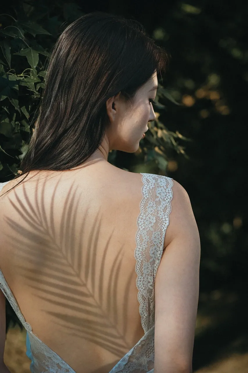 Enchanting Backlit Lace: Woman in Nature's Embrace