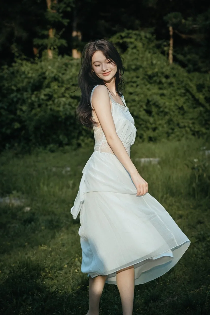 Enchanting Summer Dance: Graceful Woman in Nature's Embrace