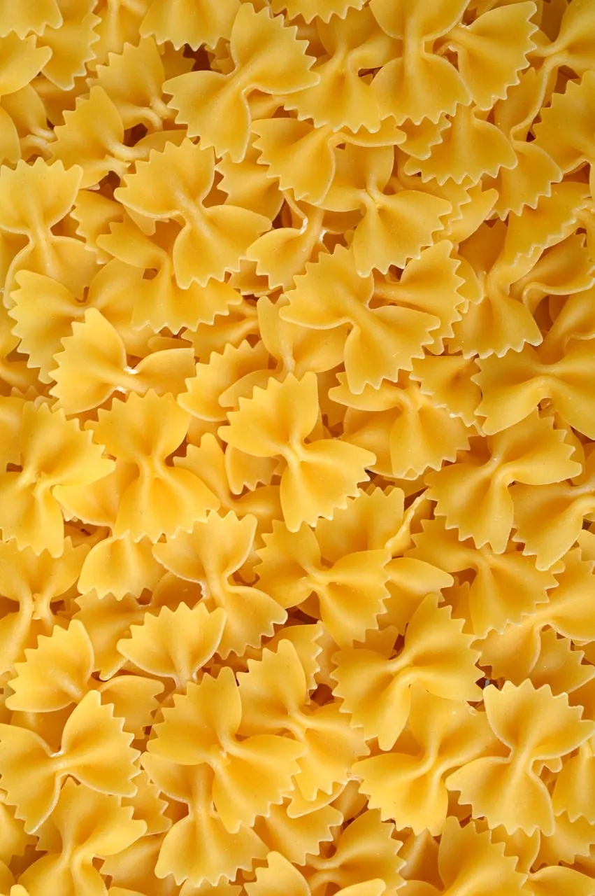 Vibrant Farfalle: A Delightful Uncooked Pasta Background