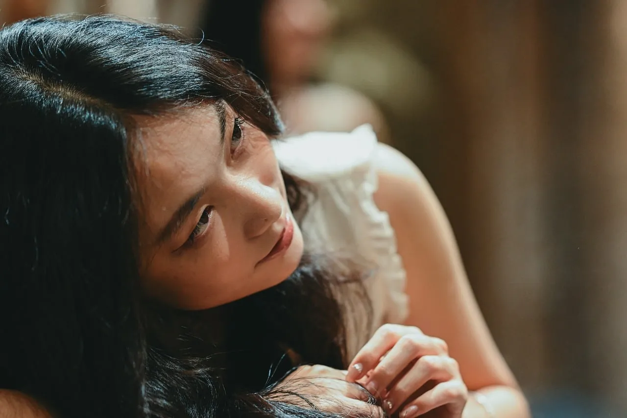 Serene Beauty: Thoughtful Woman's Peaceful Gaze