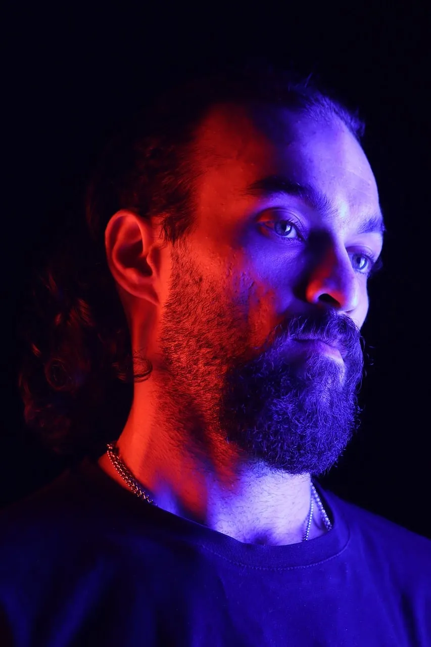 Dramatic Blue & Red Lit Man Portrait on Black Background