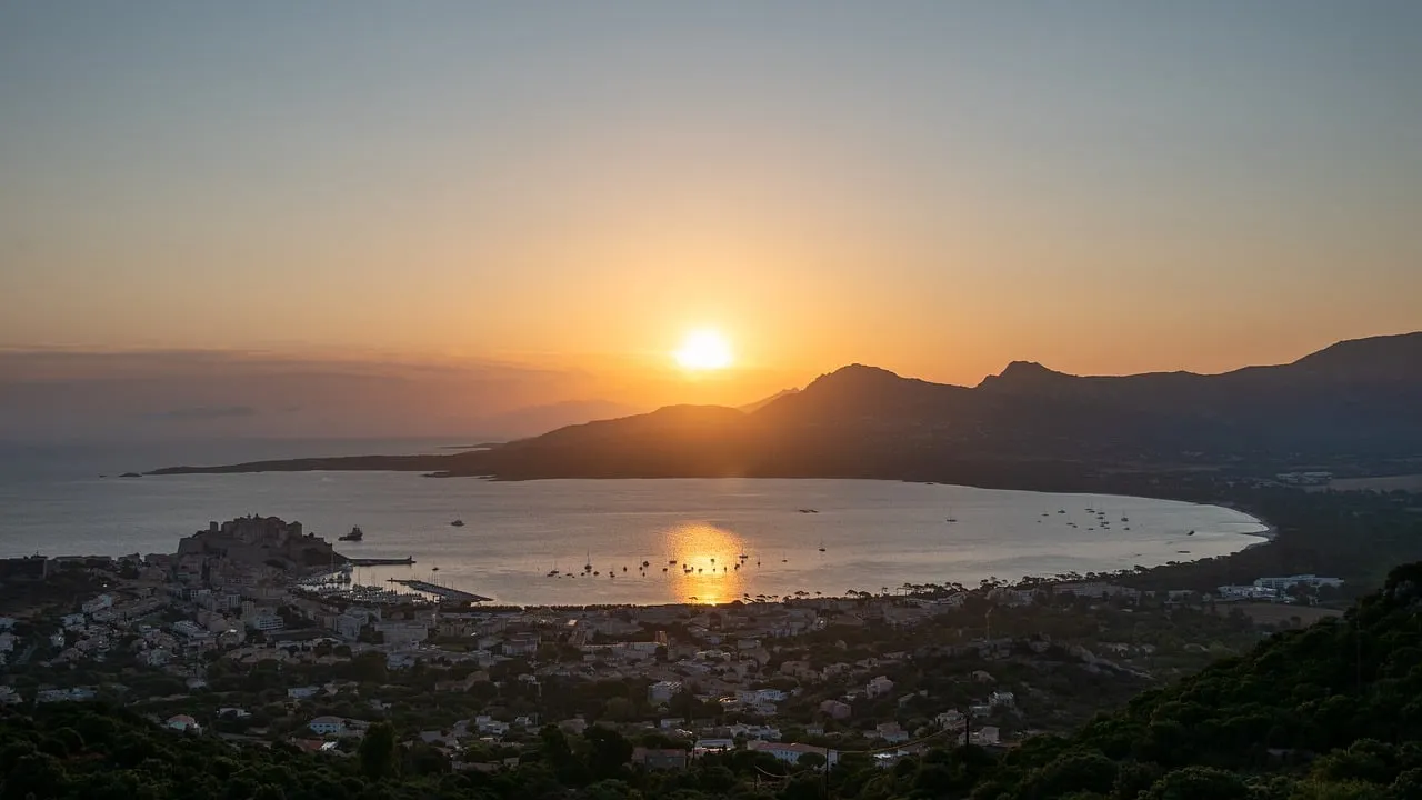 Breathtaking Calvi Sunrise: Golden Hues Over Corsica's Bay