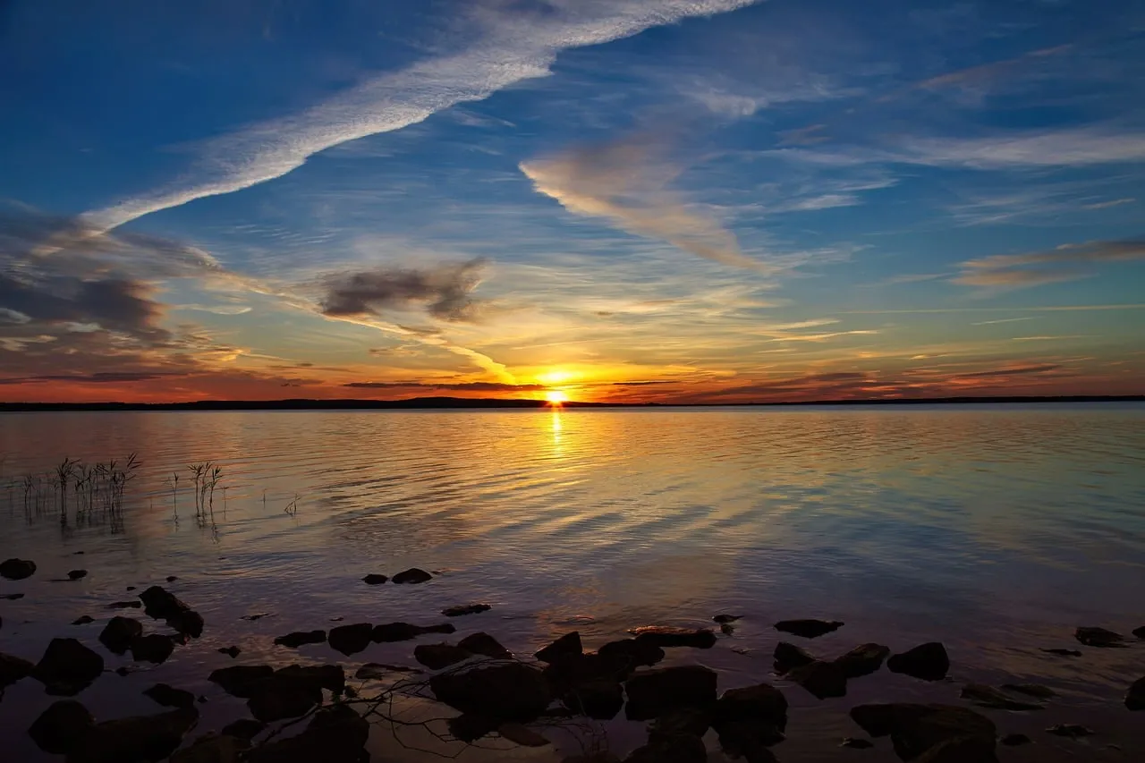 Breathtaking Autumn Sunset Reflecting on Tranquil Waters