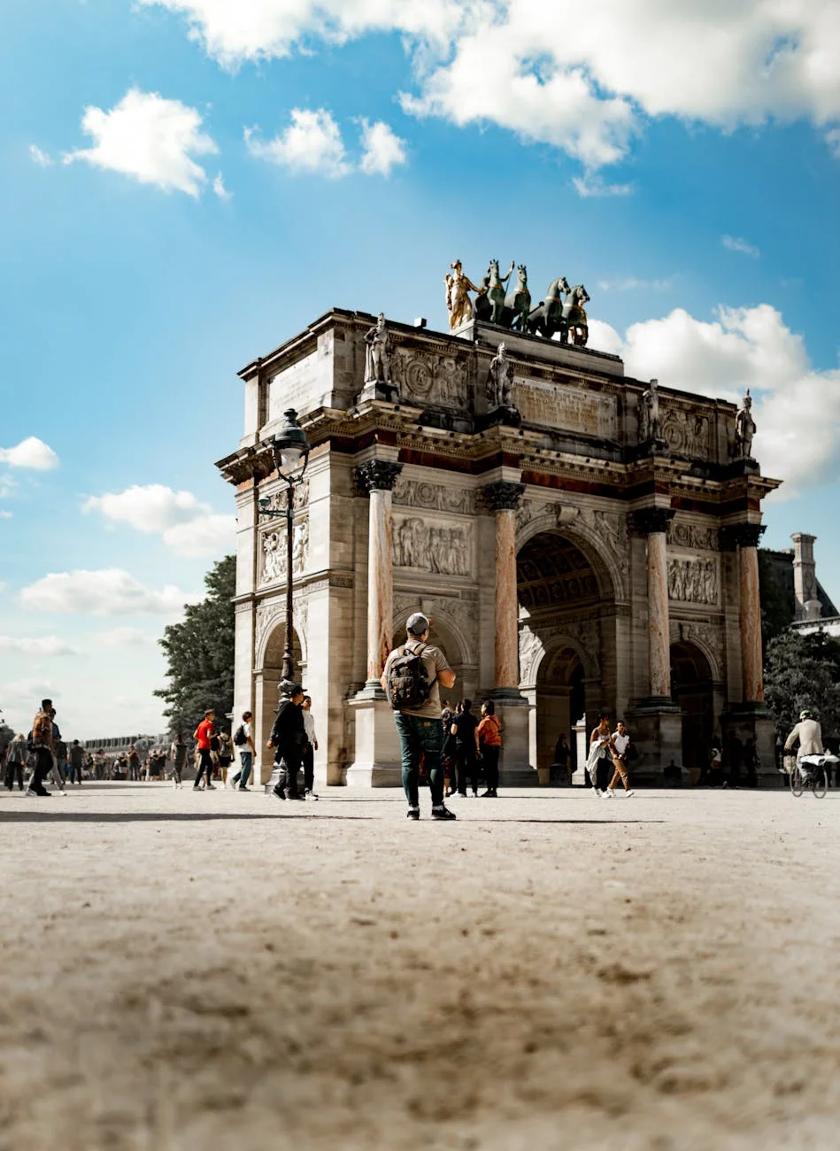 Majestic Carrousel Arch: Parisian Grandeur Under Blue Skies