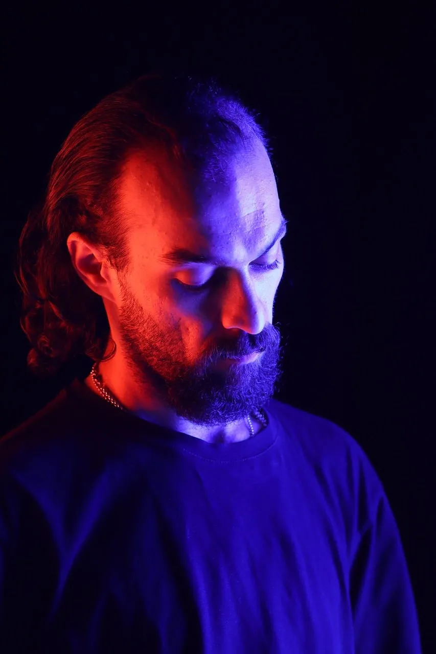 Dramatic Blue and Red Light Portrait of a Bearded Man