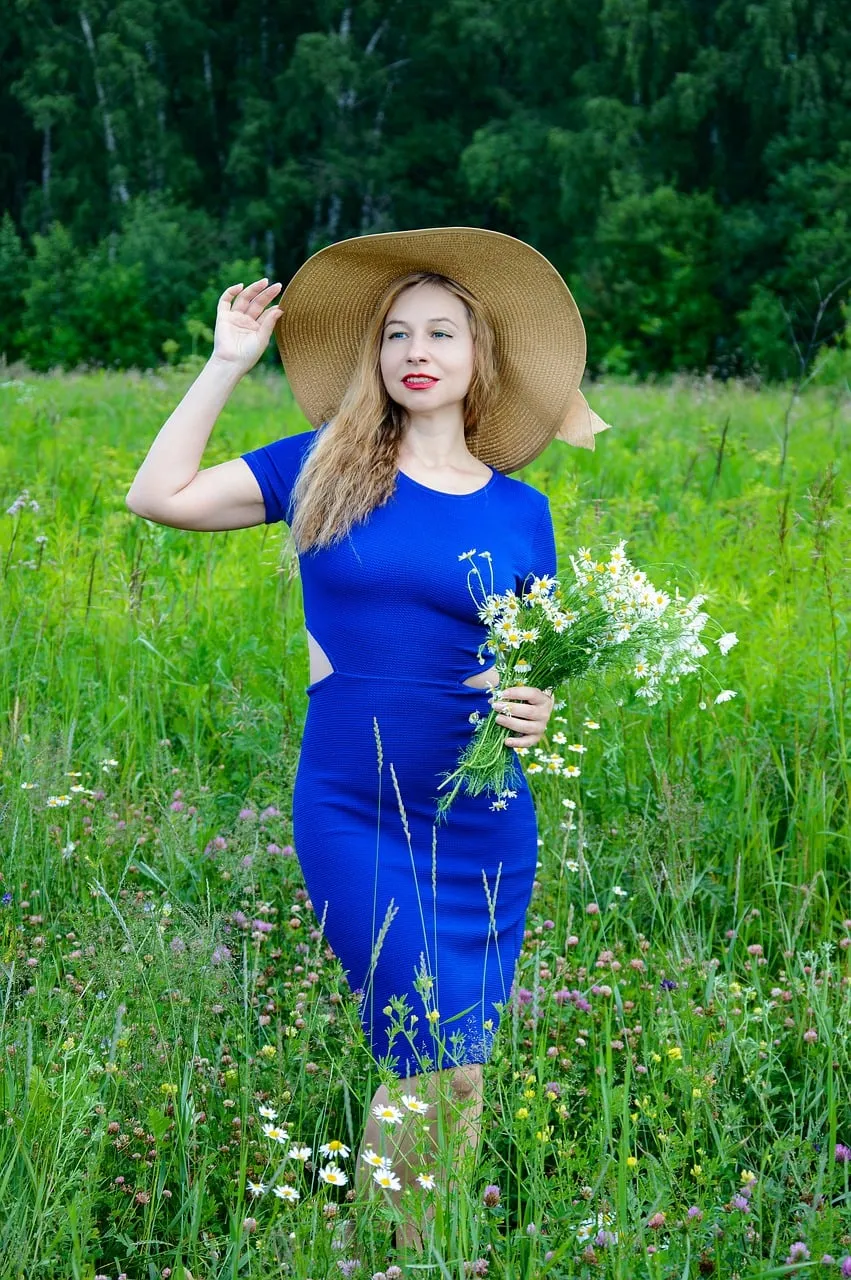 Stunning Lady in Blue Amidst a Summer Meadow