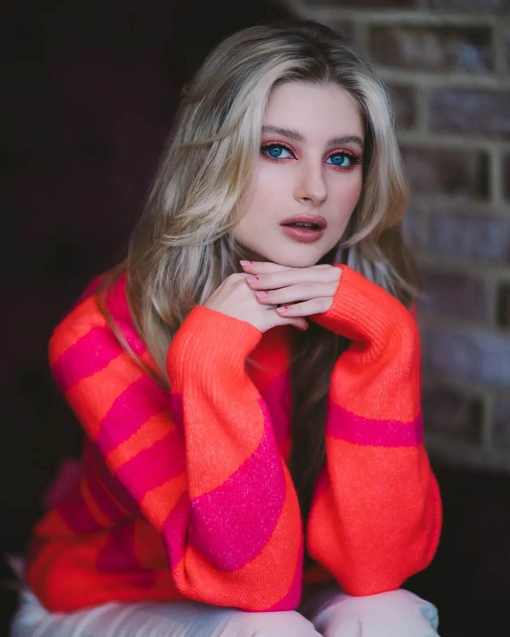 Stunning Blonde in Vibrant Sweater: A Pop of Color