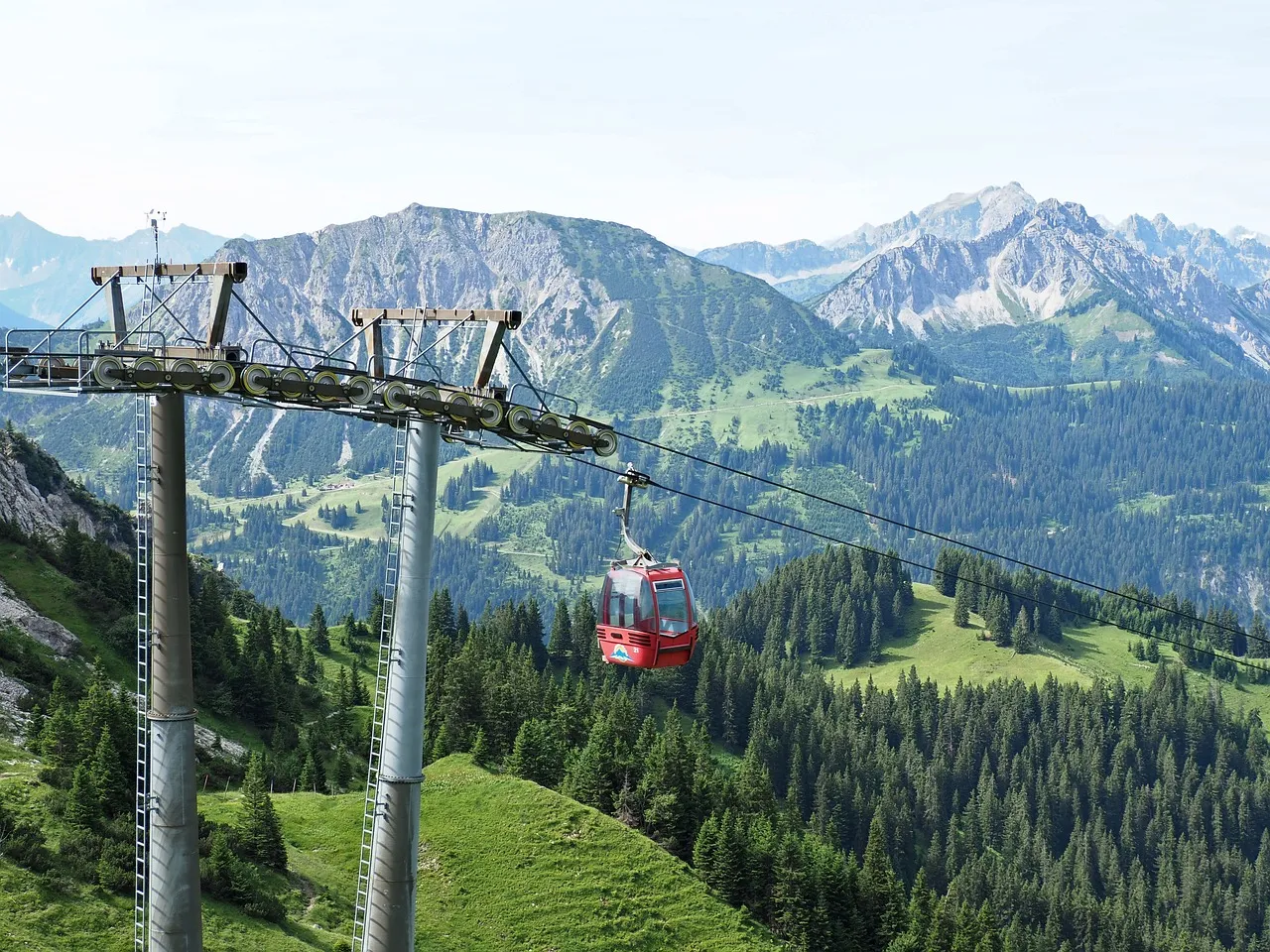 Breathtaking Alps: Red Cable Car Ascent Through Summer Peaks