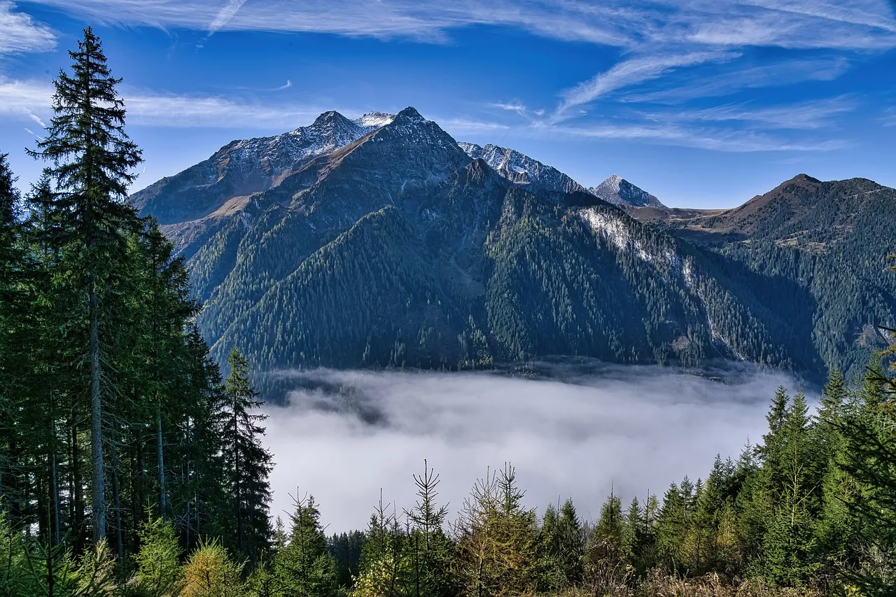 Majestic Alpine Peaks Rise Above a Sea of Clouds