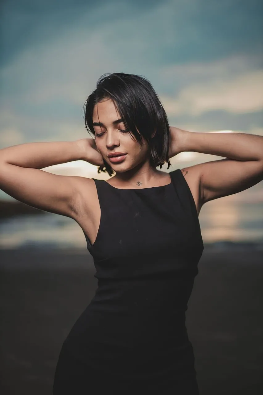 Serene Sunset Beauty: Woman Posing on a Tranquil Beach