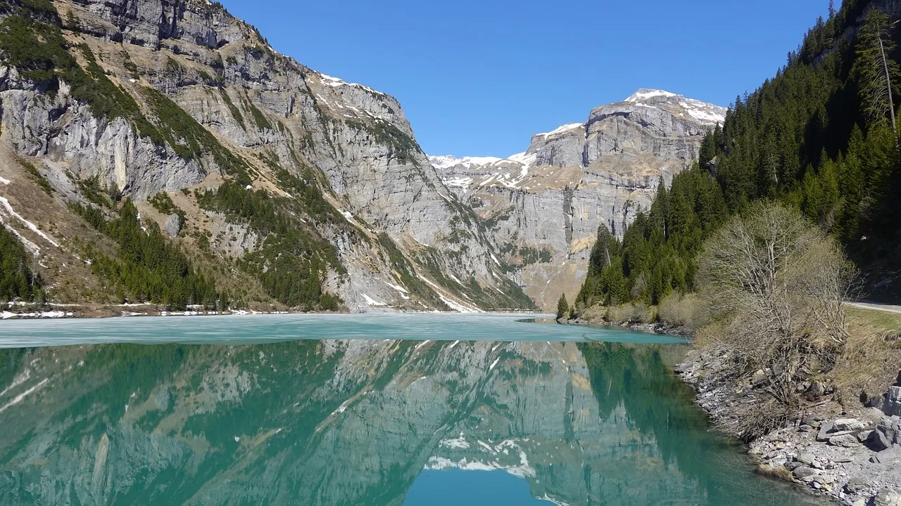 Stunning Azure Lake Reflecting Majestic Alpine Peaks