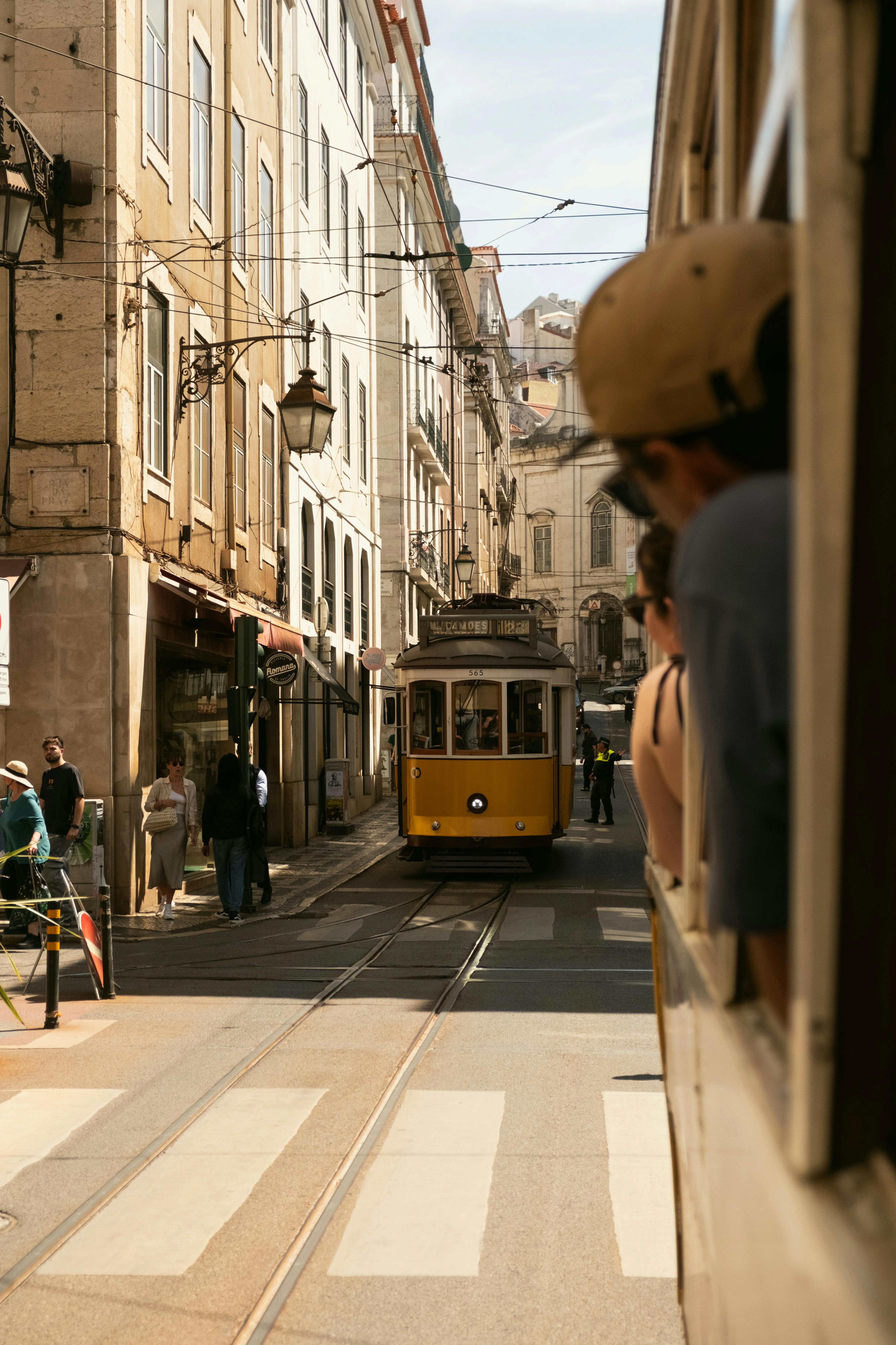 Iconic Yellow Tram Navigates Historic European City Streets
