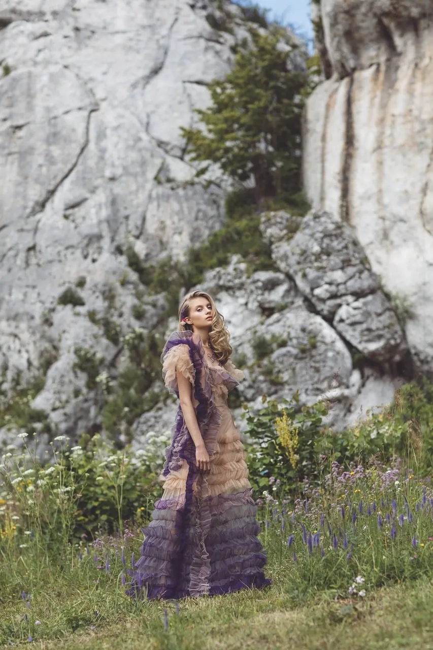 Stunning Fashion Amidst Majestic Mountain Scenery