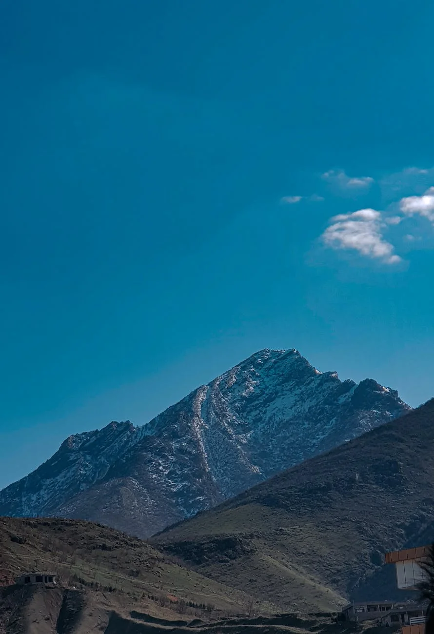 Majestic Snow-Capped Peak Under Azure Sky