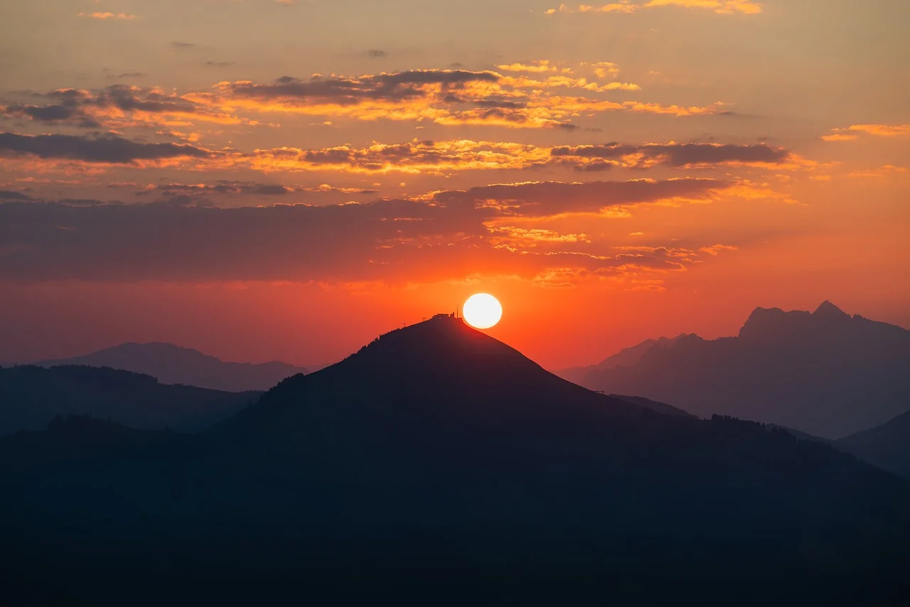 Fiery Sunset Over Majestic Alpine Peaks