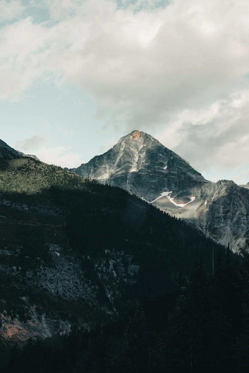Majestic Mountain Peak Embracing Whispers of Sunlight