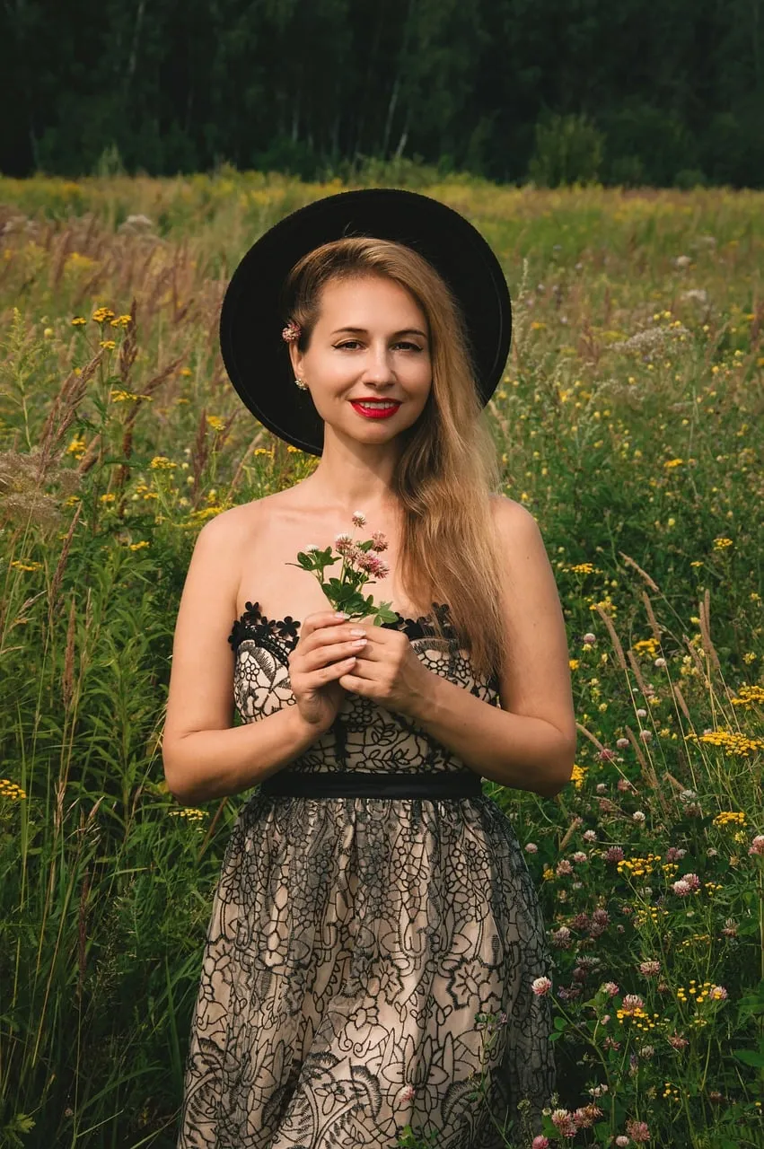 Enchanting Summer Portrait: Blonde Beauty in Wildflower Meadow