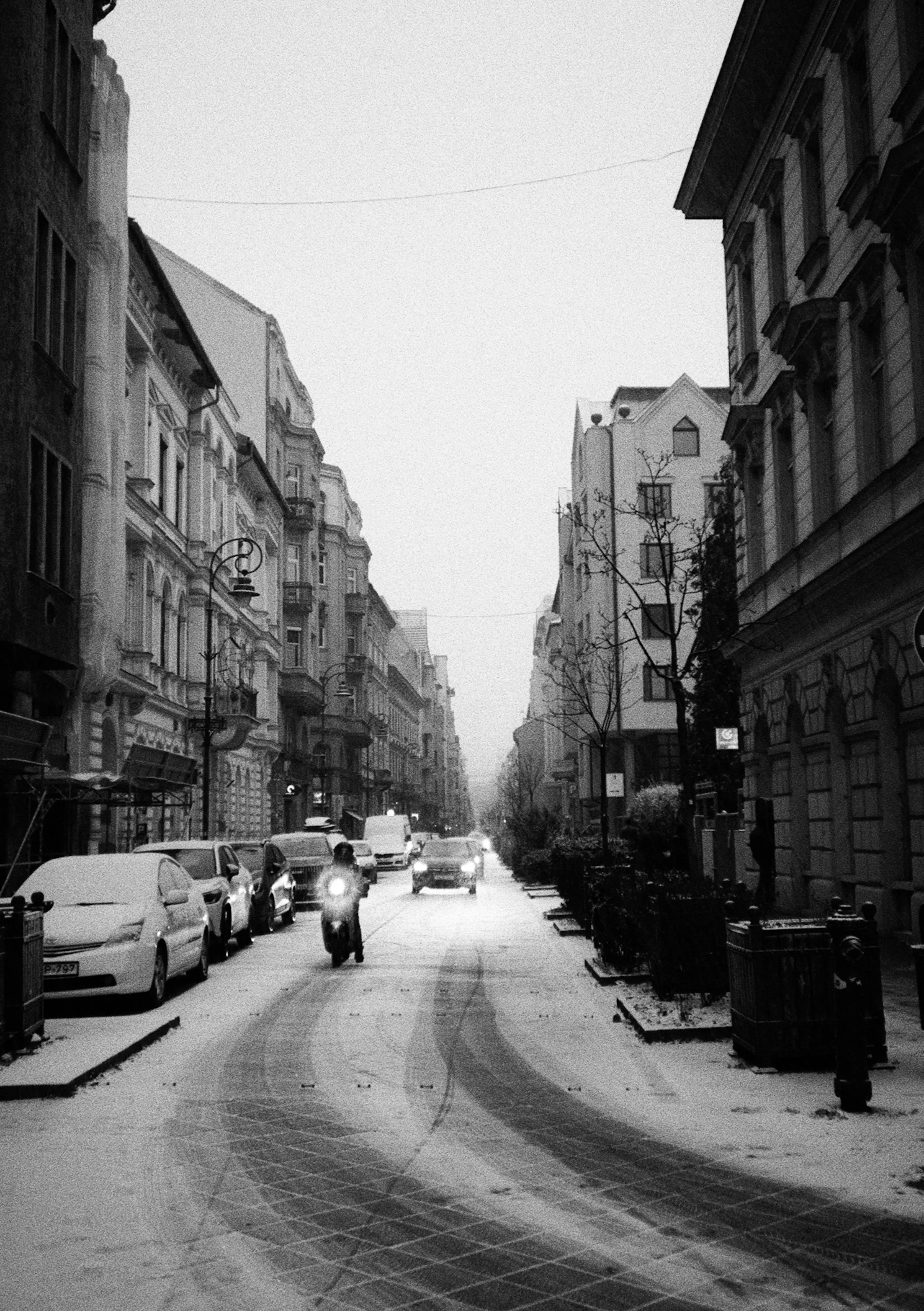 Timeless Winter Cityscape: Snowy Street in Grayscale Film